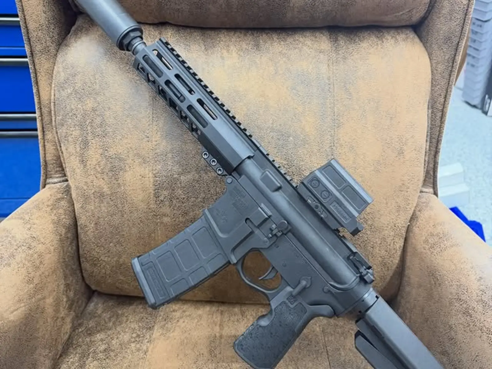 Completed rifle with handguard, optic, magazine, and adjustable stock